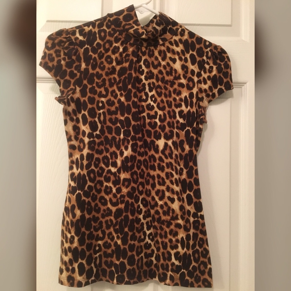 Leopard print mock neck top w/ cap sleeves.